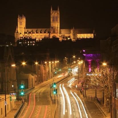 Lincoln Cathedral lit up at night above the city — the heart of the Lincolnshire area Sparta Care covers